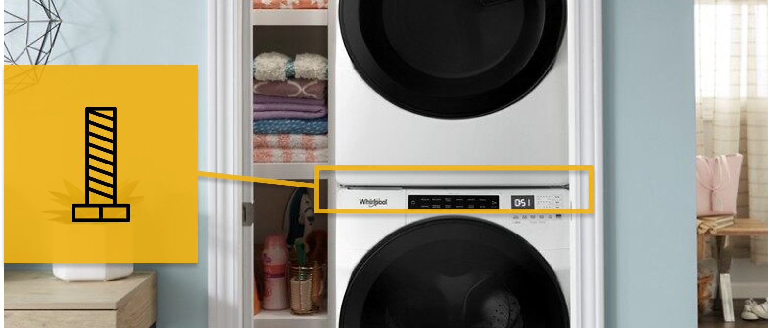 Close up of stacked white washer and dryer with a screw icon Close up of stacked white washer and dryer with a screw icon