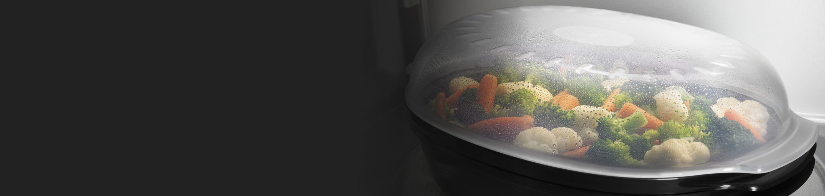 Vegetables steaming inside a microwave