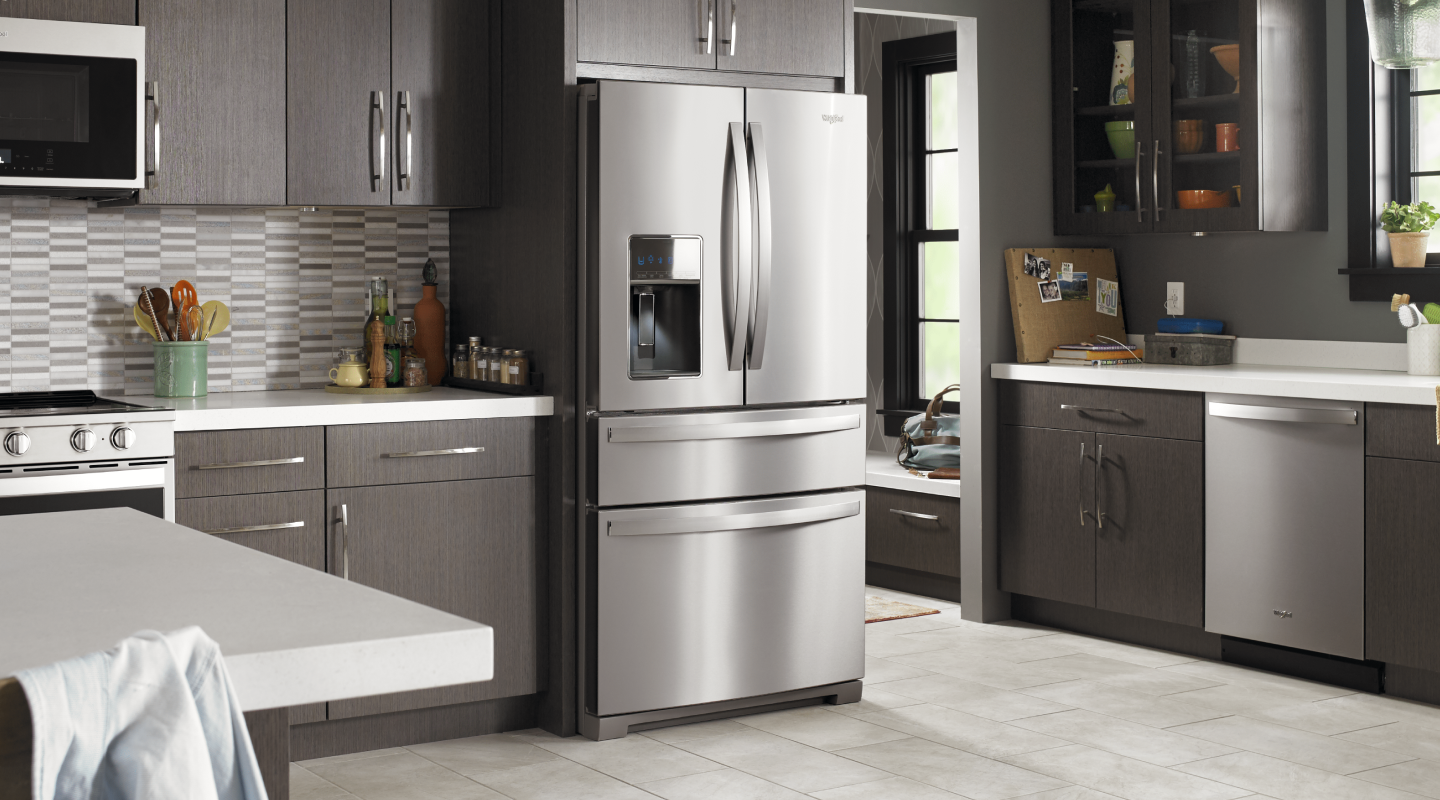 Stainless steel Whirlpool® french door refrigerator in a modern kitchen Stainless steel Whirlpool® french door refrigerator in a modern kitchen