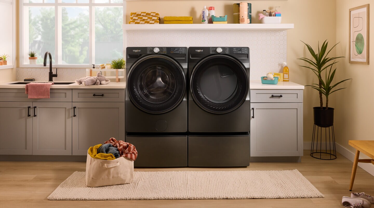 A bright laundry area with a Whirlpool® Washer and Dryer set