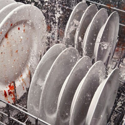 Dirty dishes washing in a Whirlpool® dishwasher