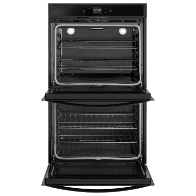 A double conventional oven with both doors opened
