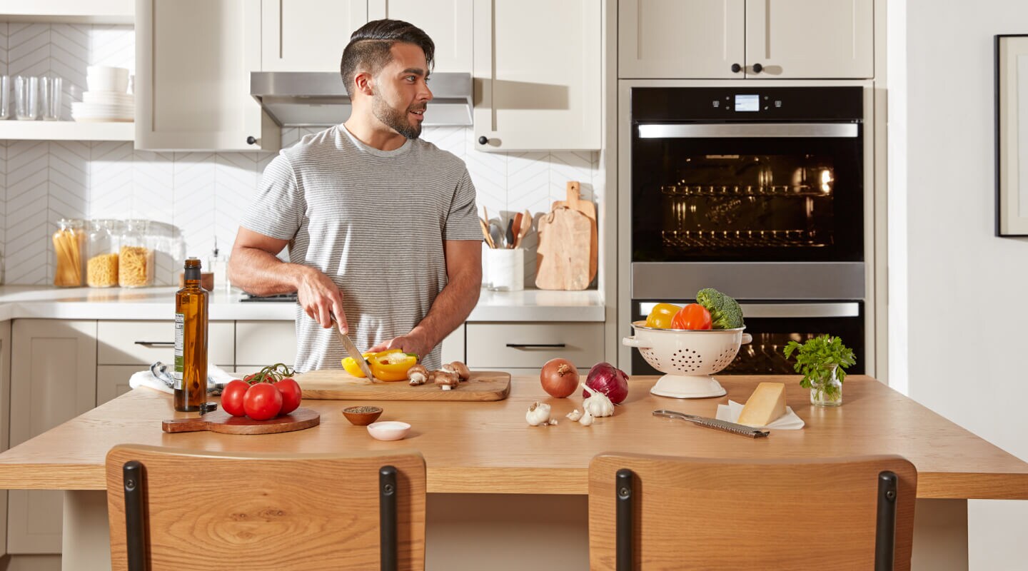A person cutting peppers