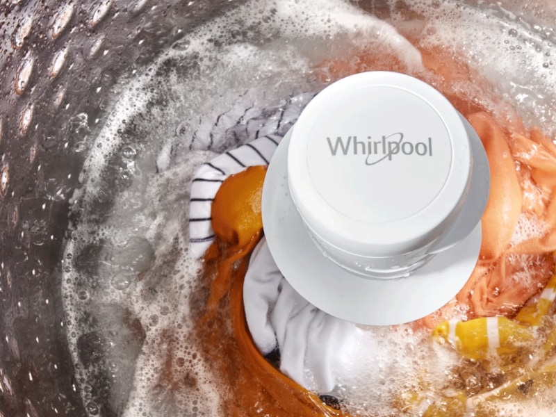 Laundry being washed inside a Whirlpool® top load washing machine Laundry being washed inside a Whirlpool® top load washing machine