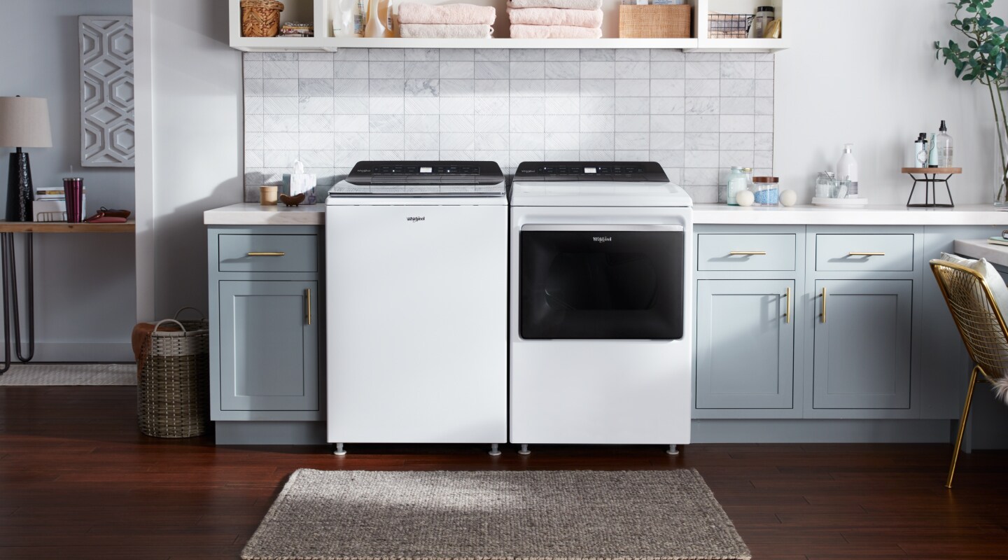 White Whirlpool® top loading washer and dryer White Whirlpool® top loading washer and dryer