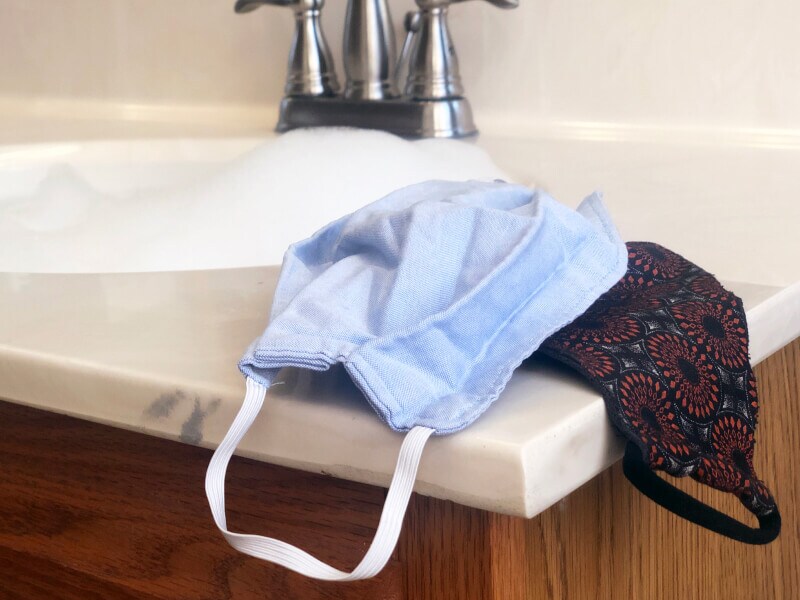 Cloth face masks next to a sink Cloth face masks next to a sink