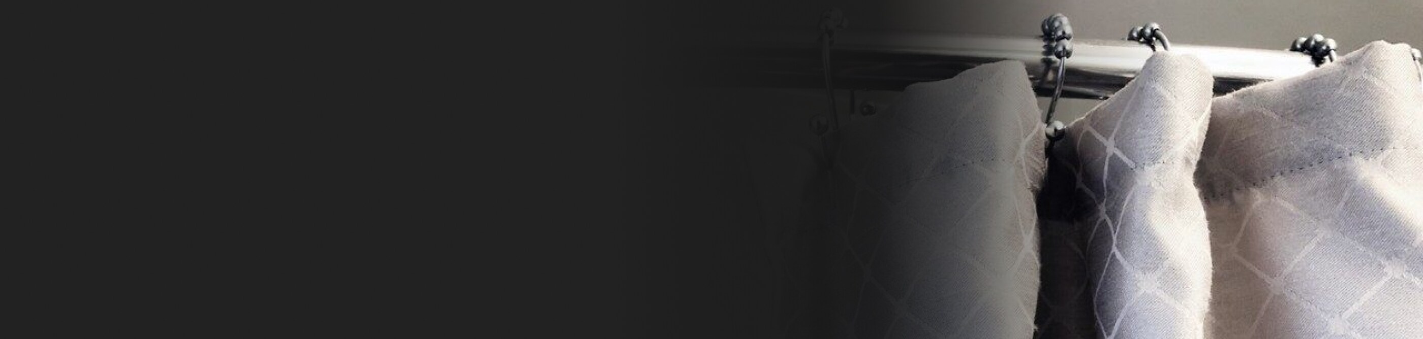 A gray and white shower curtain.