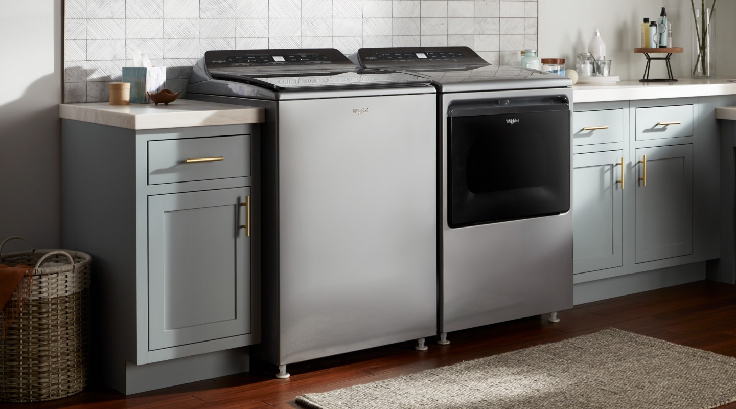 A gray washer and dryer set in a laundry room A gray washer and dryer set in a laundry room