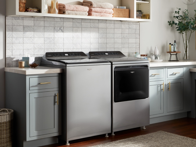 A gray washer and dryer set in a laundry room A gray washer and dryer set in a laundry room