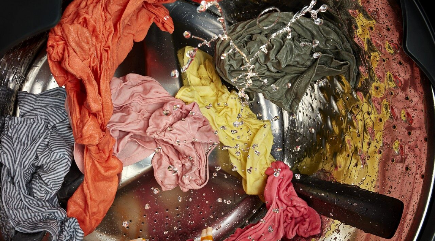 Clothes being washed in the washer Clothes being washed in the washer