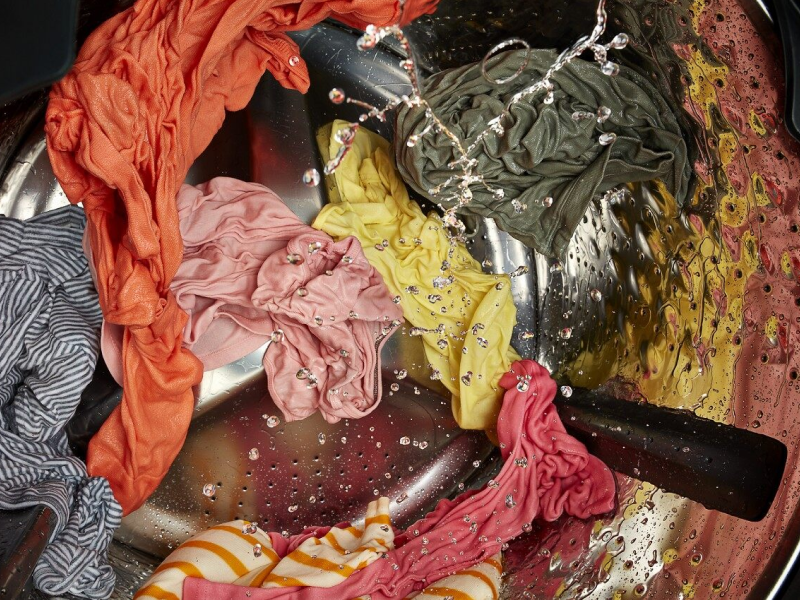 Clothes being washed in the washer Clothes being washed in the washer