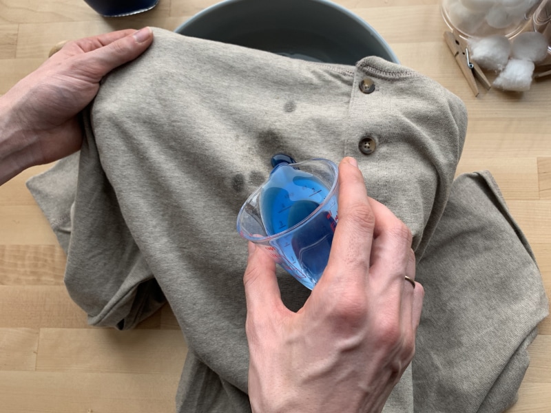 Person spot treating shirt Person spot treating shirt