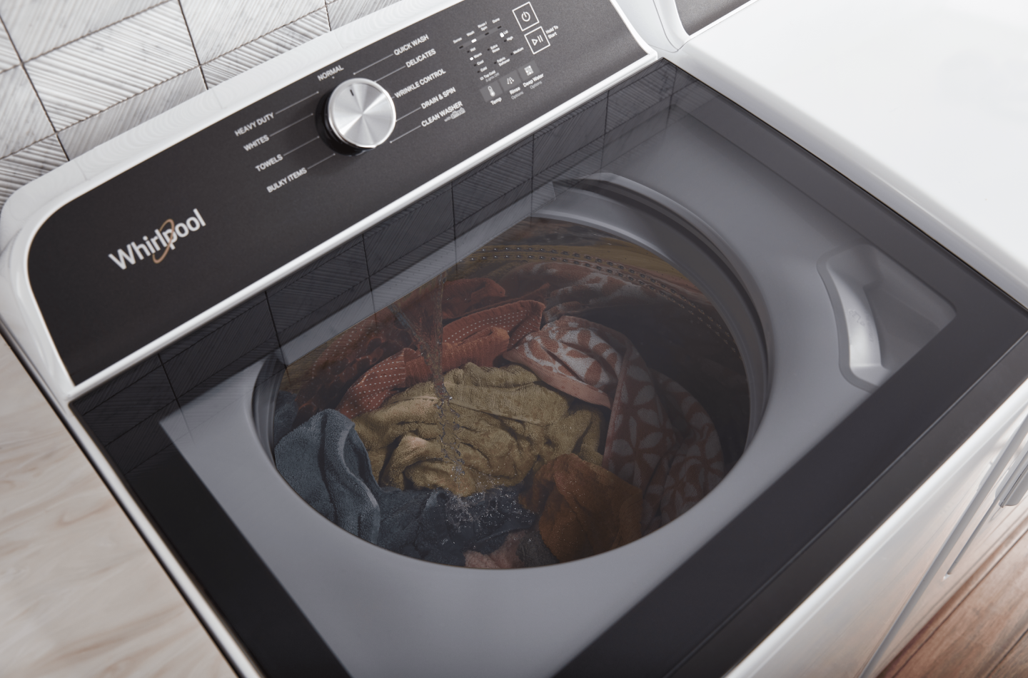 Black and white Whirlpool washer with washing knits Black and white Whirlpool washer with washing knits