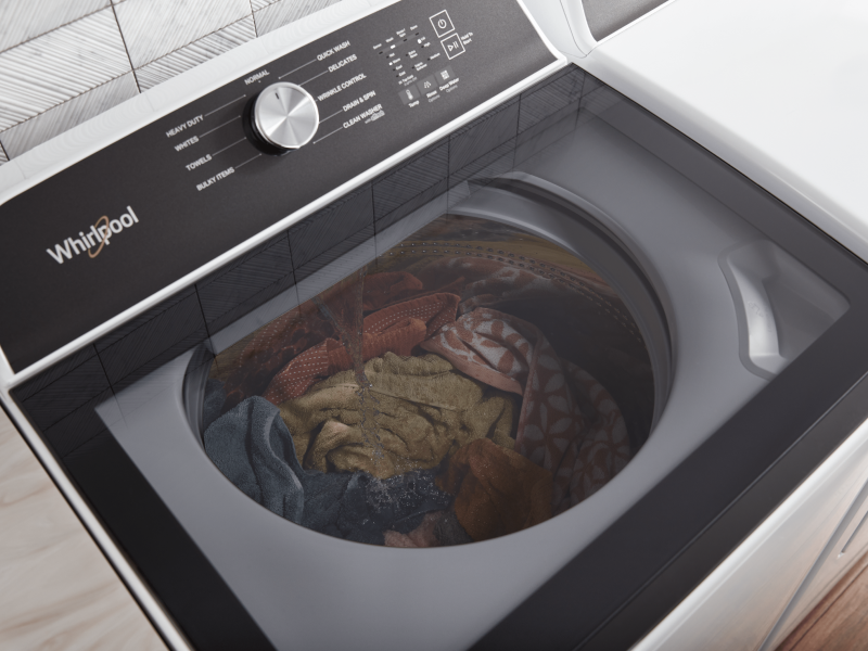 Black and white Whirlpool washer with washing knits Black and white Whirlpool washer with washing knits
