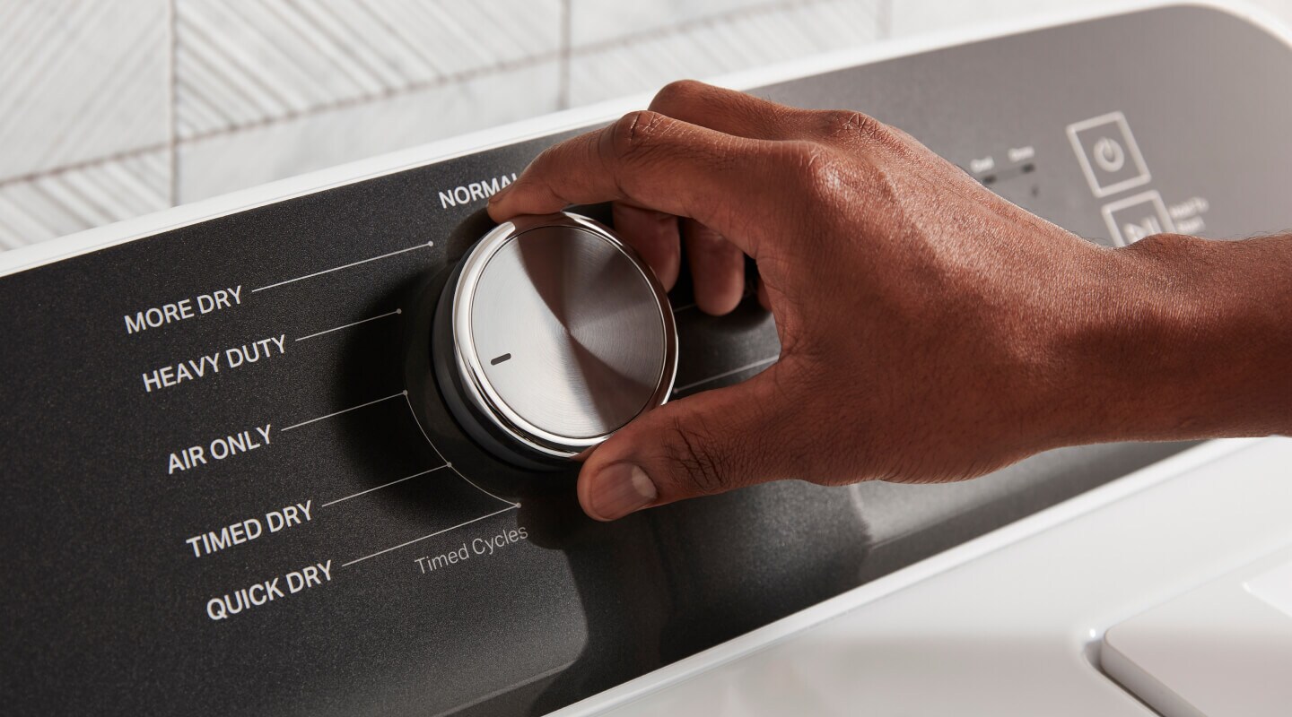 A person selecting Air Only dry on a dryer