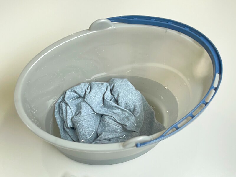 Leggings soaking in a bucket of water