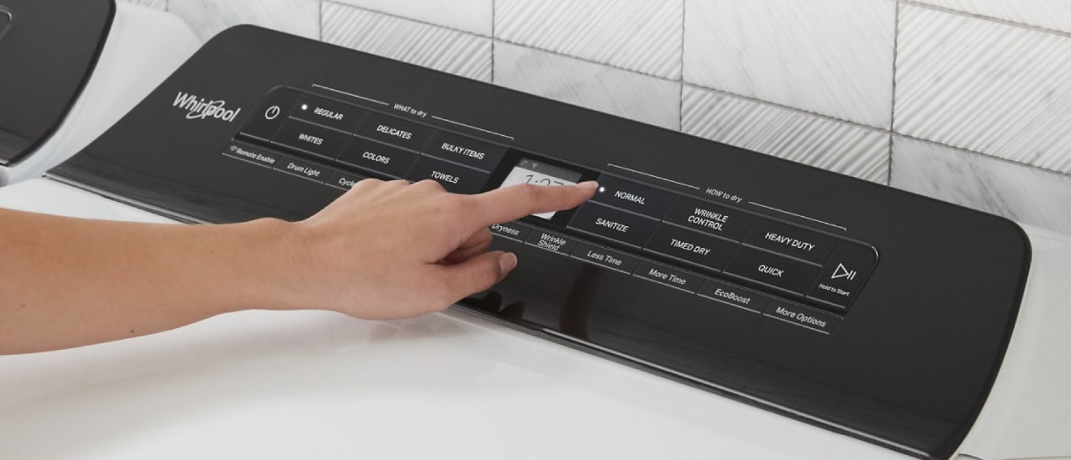 Person selecting a cycle on a Whirlpool® Washer Person selecting a cycle on a Whirlpool® Washer