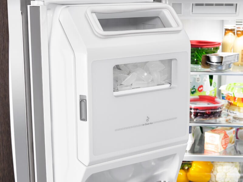 In-door ice maker inside a refrigerator