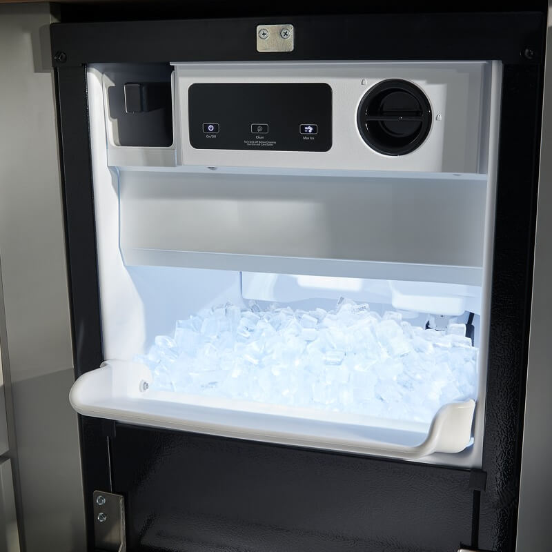 Open black icemaker full of ice cubes