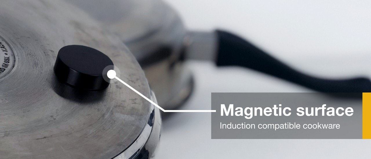 A magnet stuck to the bottom of induction compatible cookware  A magnet stuck to the bottom of induction compatible cookware