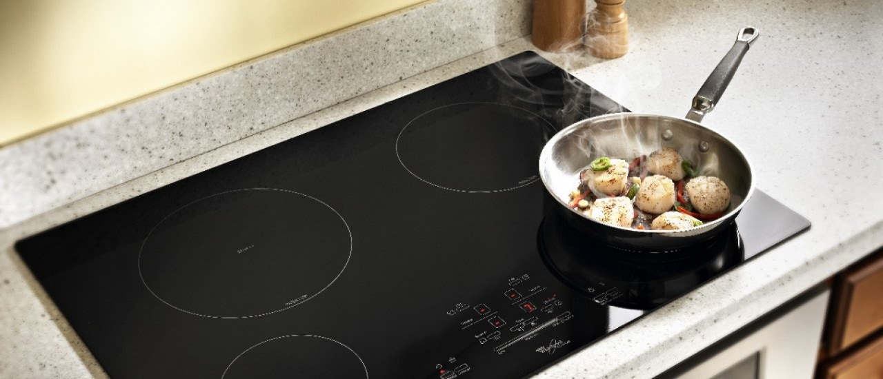 A pan on an induction cooktop A pan on an induction cooktop
