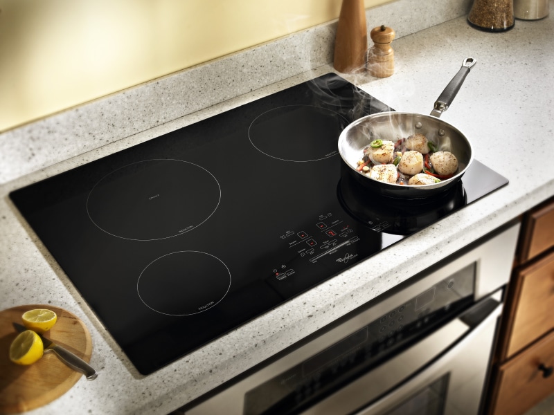 Food cooking in a sauce pan on a Whirlpool® Induction Cooktop Food cooking in a sauce pan on a Whirlpool® Induction Cooktop