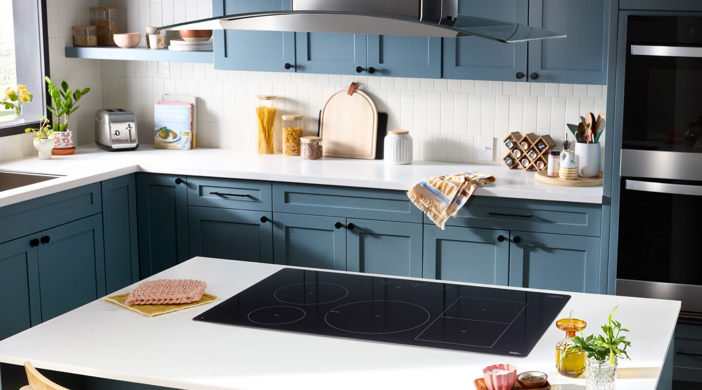 Induction cooktop in a blue and white kitchen