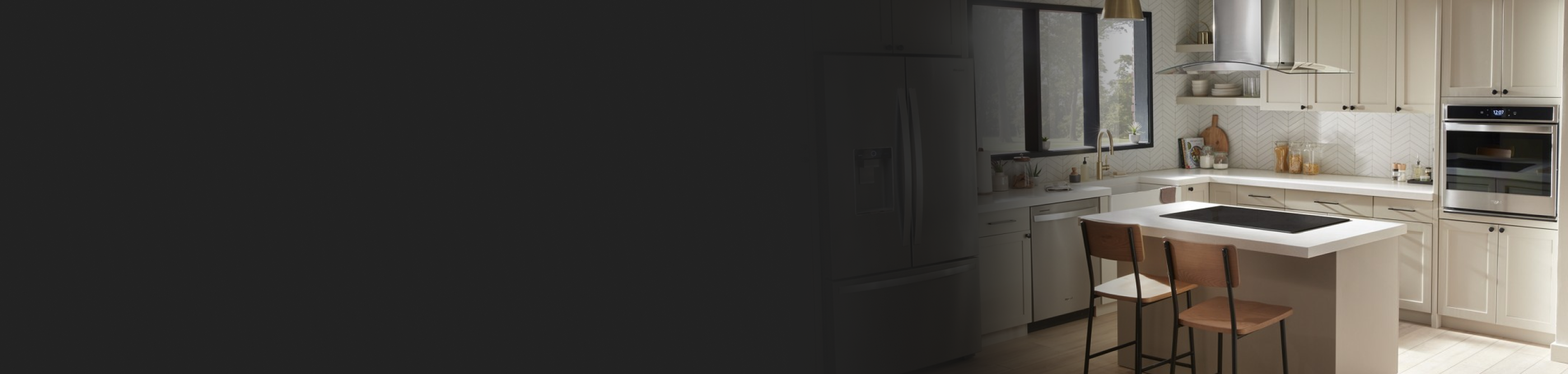 Off white kitchen with cooktop in island