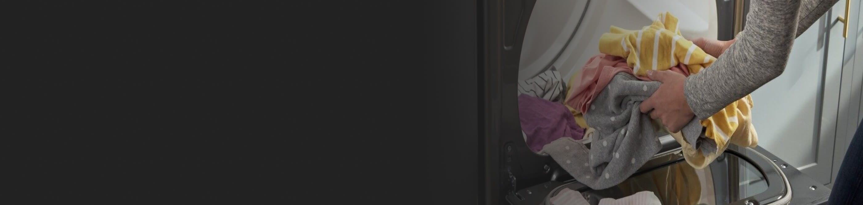 Person removing clothes from the dryer