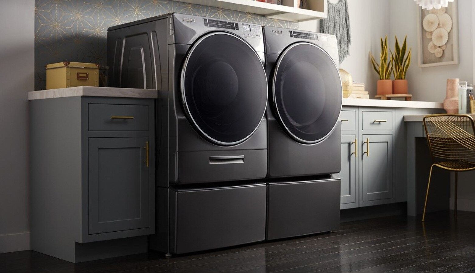 Whirlpool® front loading washer and dryer in a modern laundry room