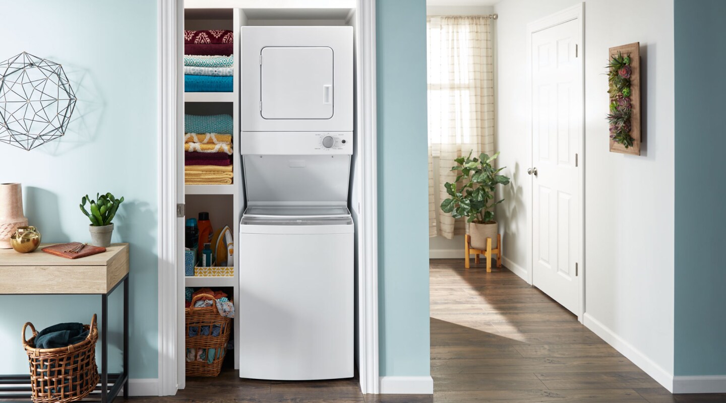 Stacked laundry center in a closet