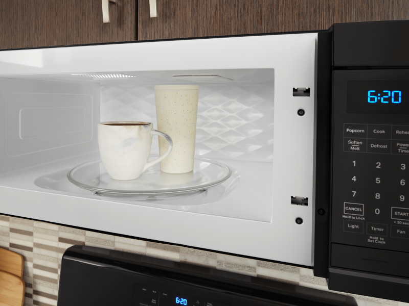 Two drink cups in a microwave Two drink cups in a microwave