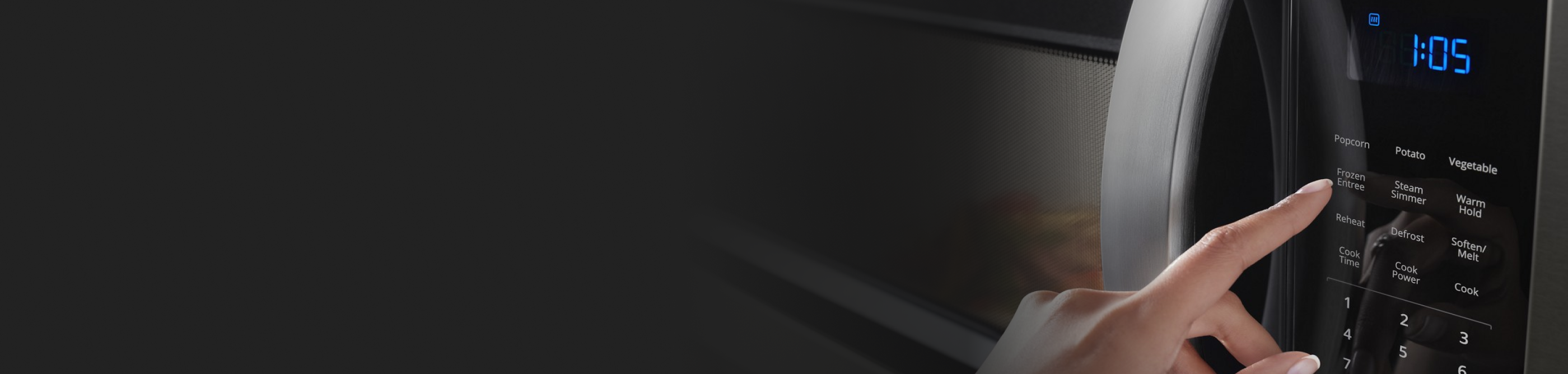 Person selecting settings on a microwave control panel