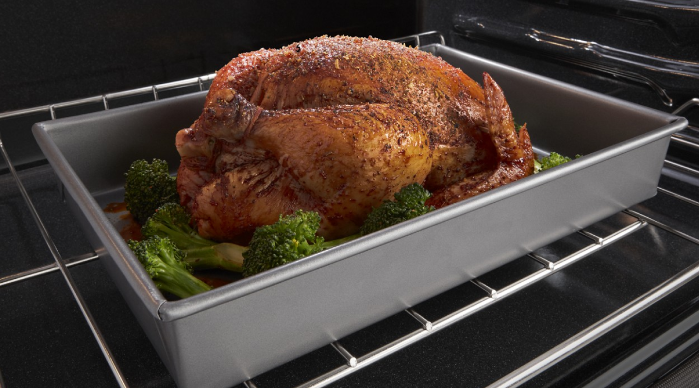 Whole chicken roasting in oven Whole chicken roasting in oven