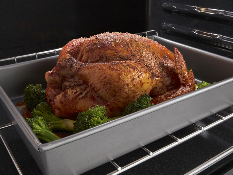 Whole chicken roasting in oven Whole chicken roasting in oven