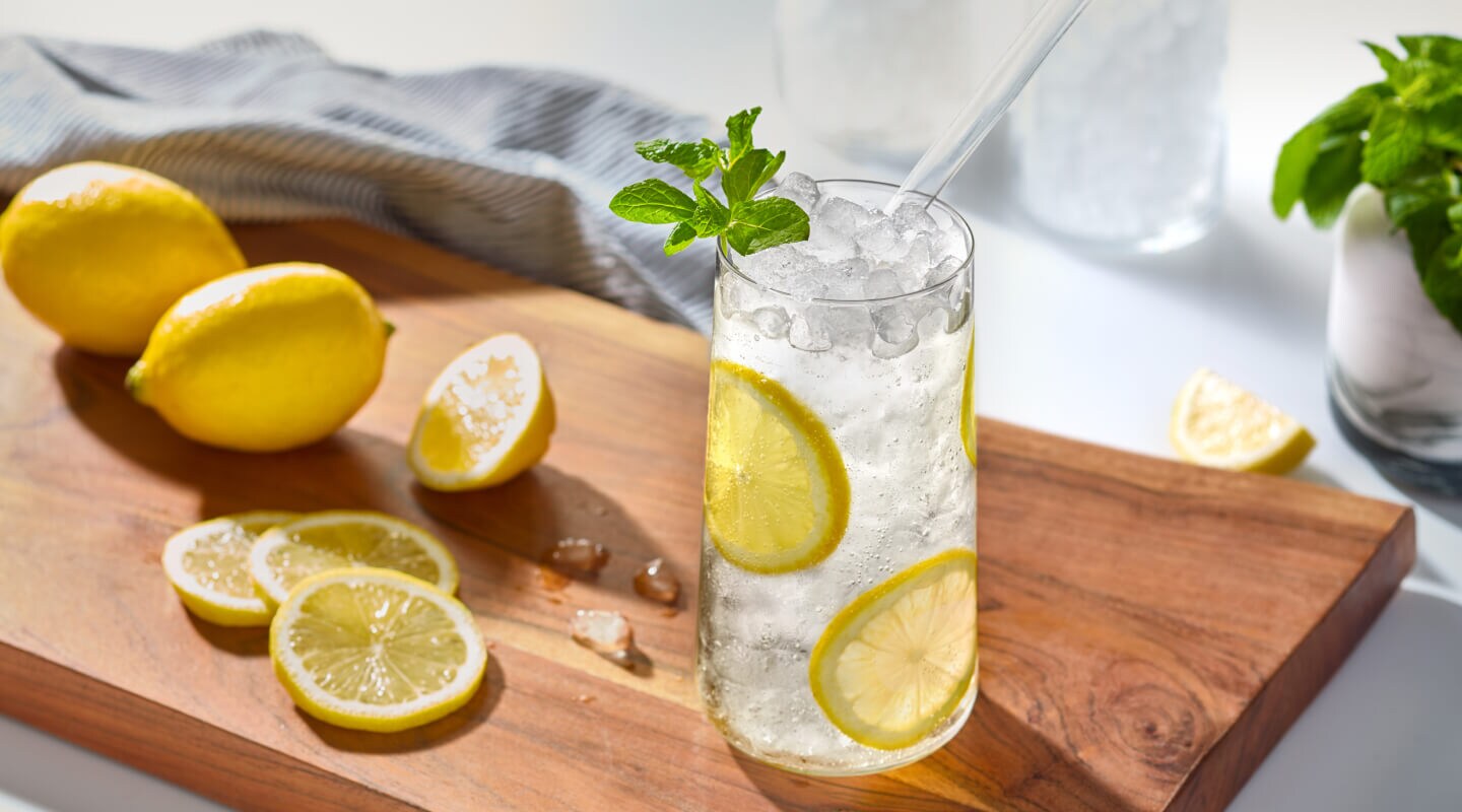 Lemon water in a glass with nugget ice