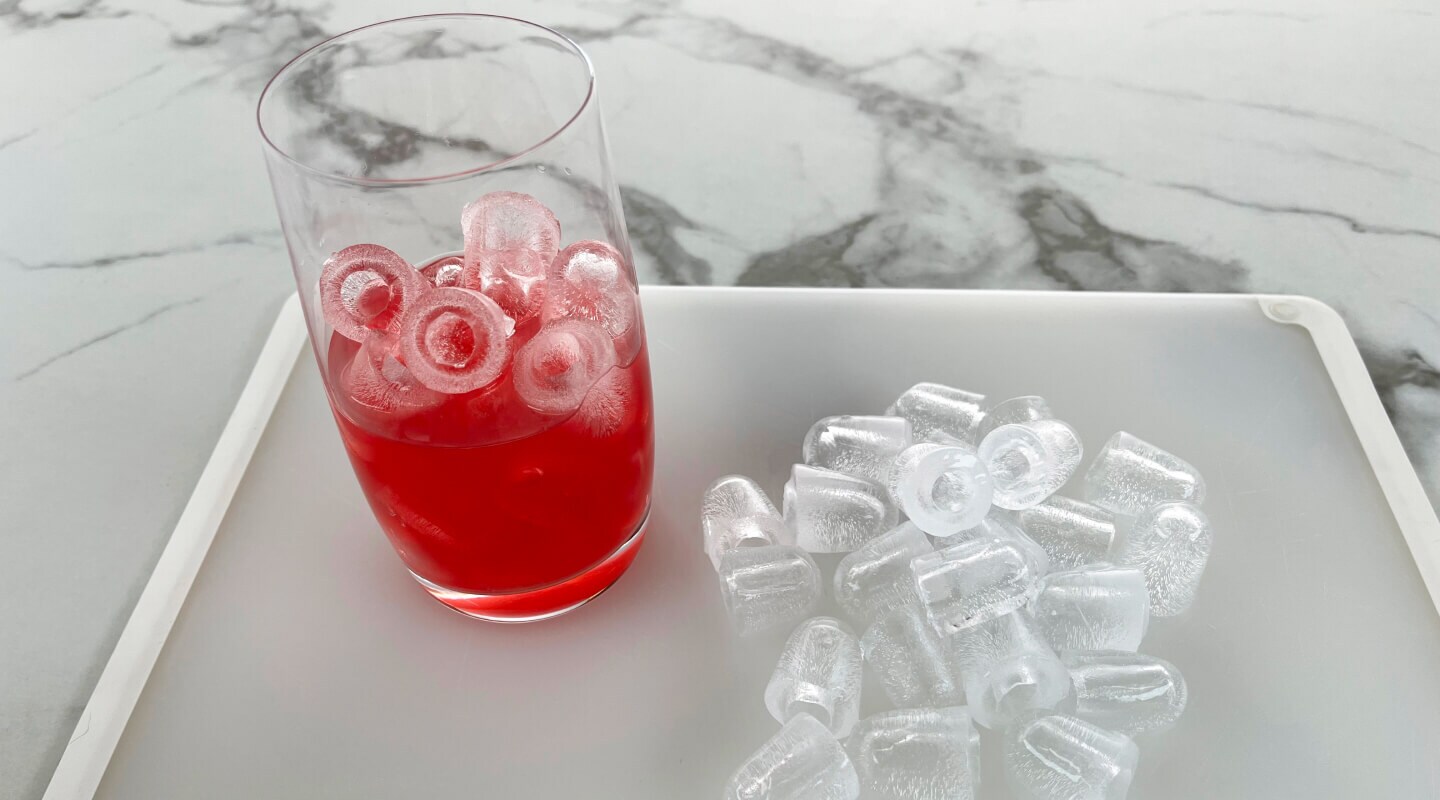 Bullet ice in a glass with punch