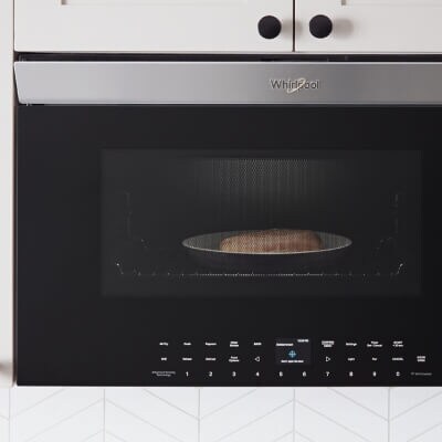 Close-up of food cooking inside an over-the-range microwave