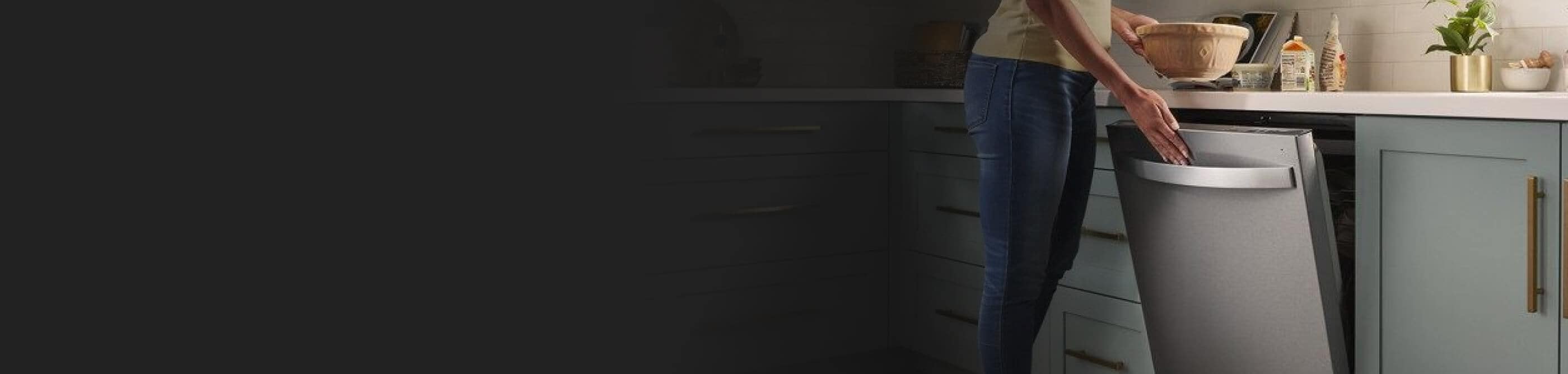 Person closing a stainless steel Whirlpool® Dishwasher