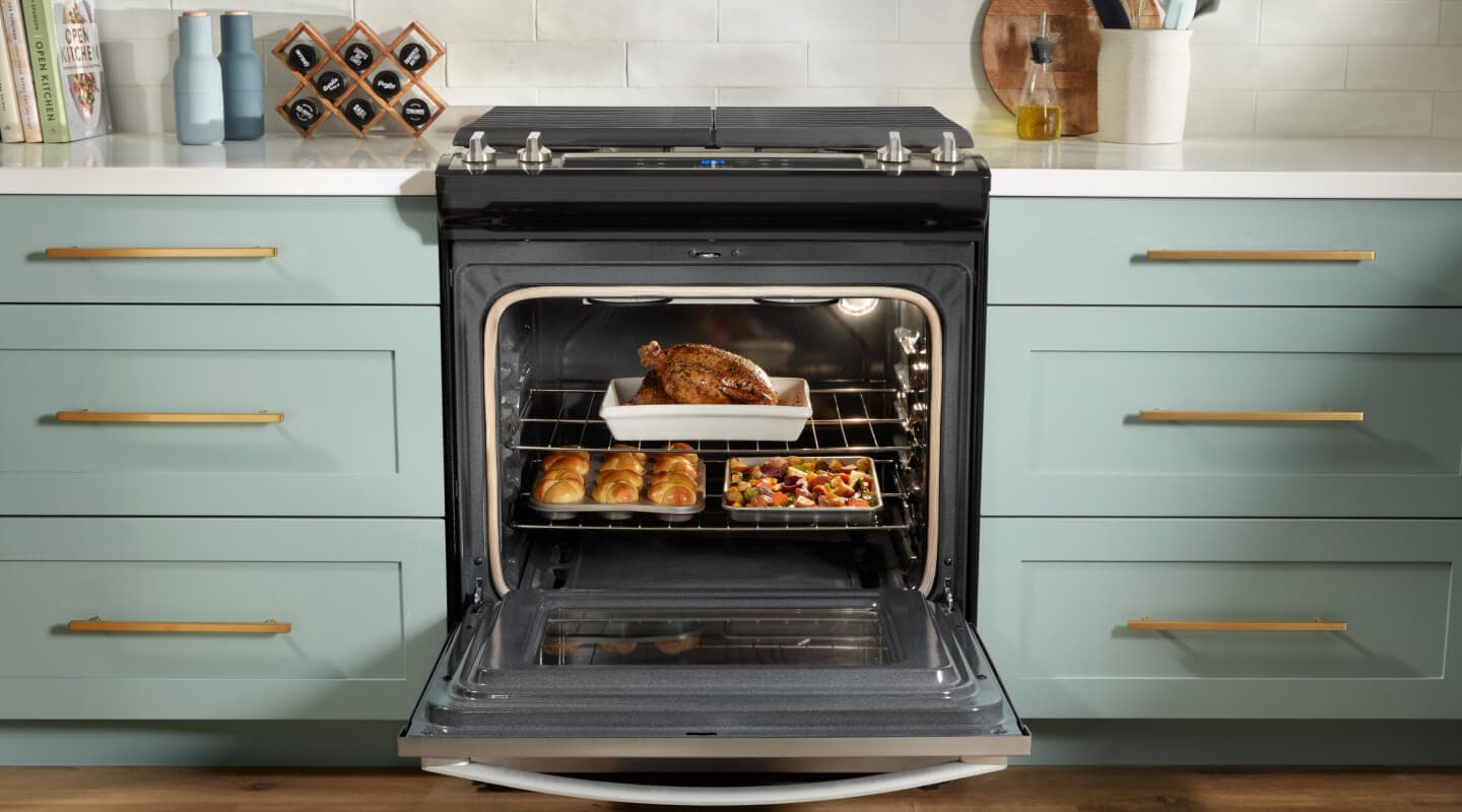 Whirlpool® oven open to show food on multiple racks Whirlpool® oven open to show food on multiple racks