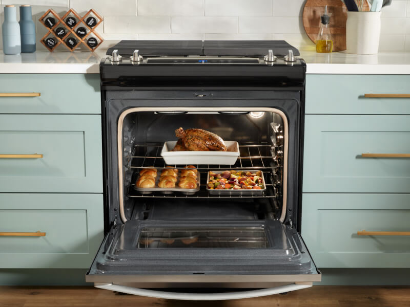Whirlpool® oven open to show food on multiple racks Whirlpool® oven open to show food on multiple racks