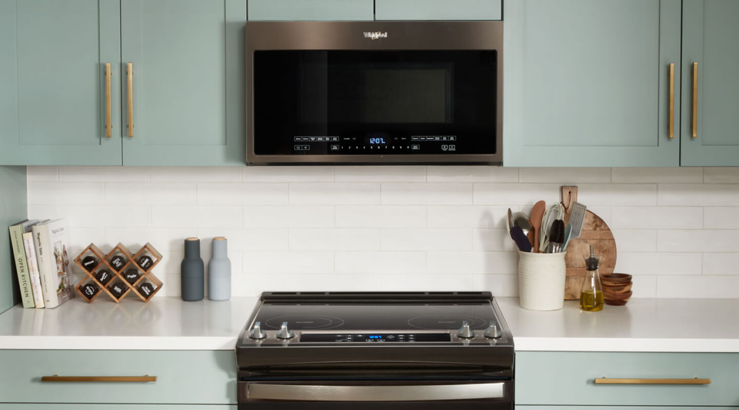 Whirlpool® over-the-range microwave installed above a Whirlpool® electric range Whirlpool® over-the-range microwave installed above a Whirlpool® electric range