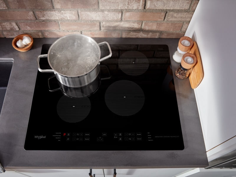 Pot of boiling water on an induction cooktop Pot of boiling water on an induction cooktop