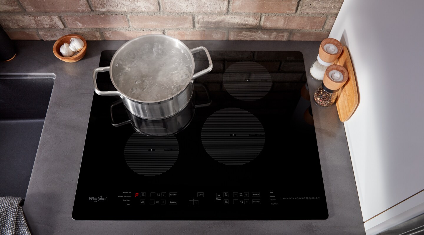 Pot of boiling water on an induction cooktop Pot of boiling water on an induction cooktop