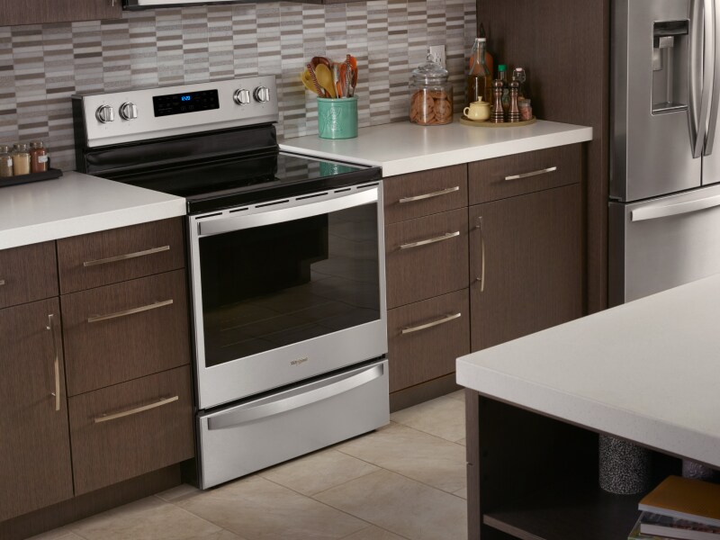 Range with an induction cooktop installed in between countertops Range with an induction cooktop installed in between countertops
