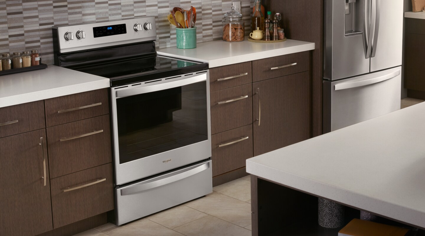 Range with an induction cooktop installed in between countertops Range with an induction cooktop installed in between countertops