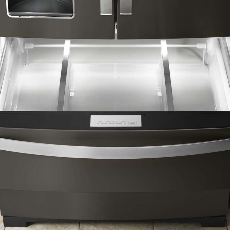 Empty bottom freezer drawer pulled out with LED lighting activated