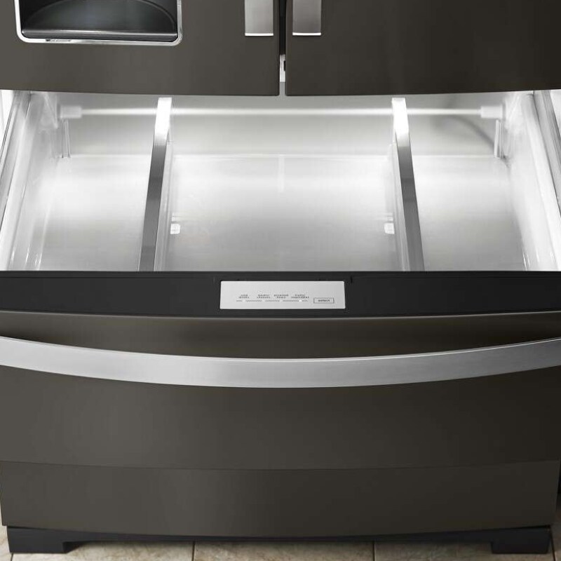 Empty bottom freezer drawer pulled out with LED lighting activated