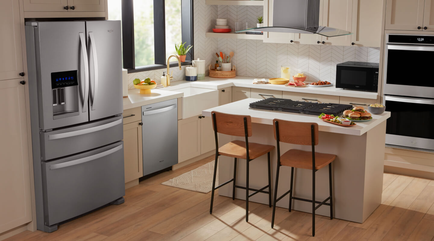 Stainless steel Whirlpool® Refrigerator with an exterior drawer in cream cabinetry