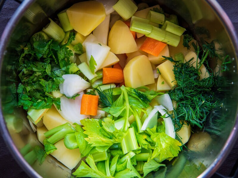 Chopped root vegetables in a colander